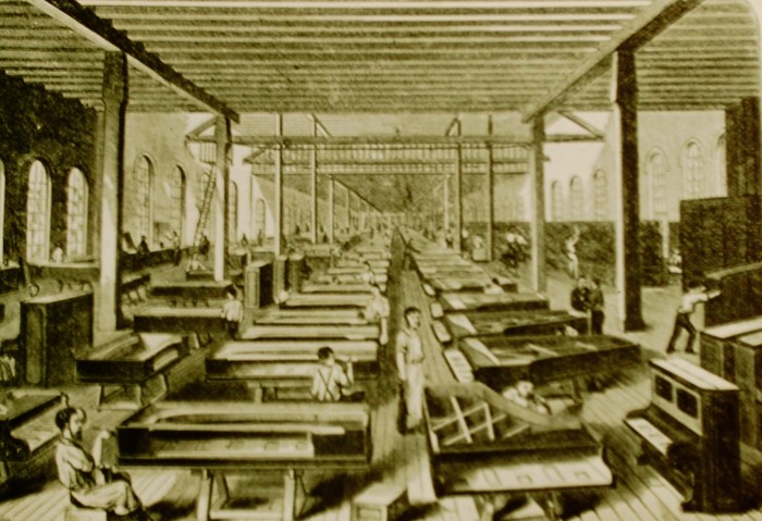 A line of pianos being built
